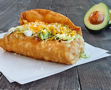 Chimichanga Filled, Fried and Topped with Cheese, Guacamole and Sour Cream